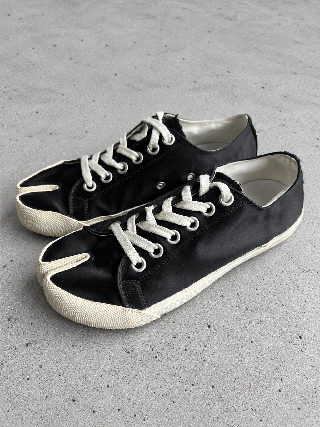 Maison Margiela Black Canvas Tabi Sneakers Size 37 — light grey concrete background